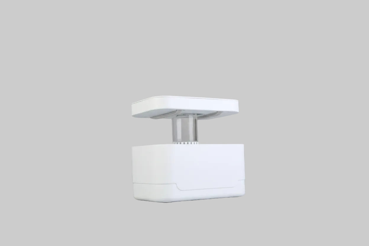 White ceiling-mounted light fixture on a plain white wall
